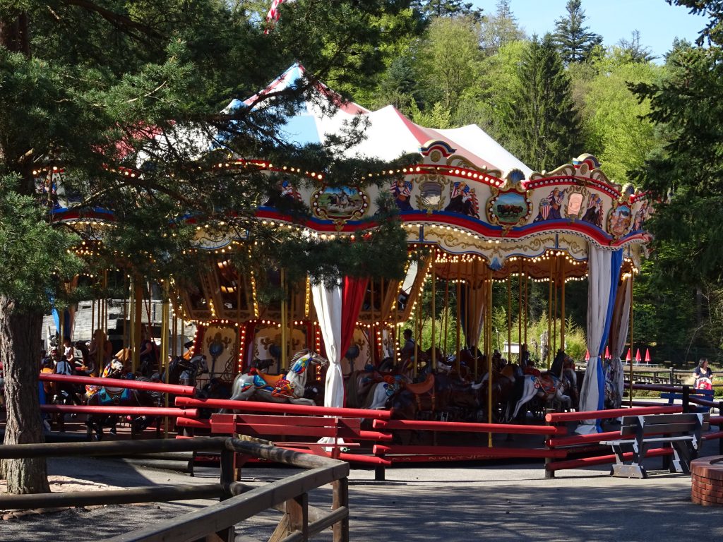 The carousel of wooden horses.